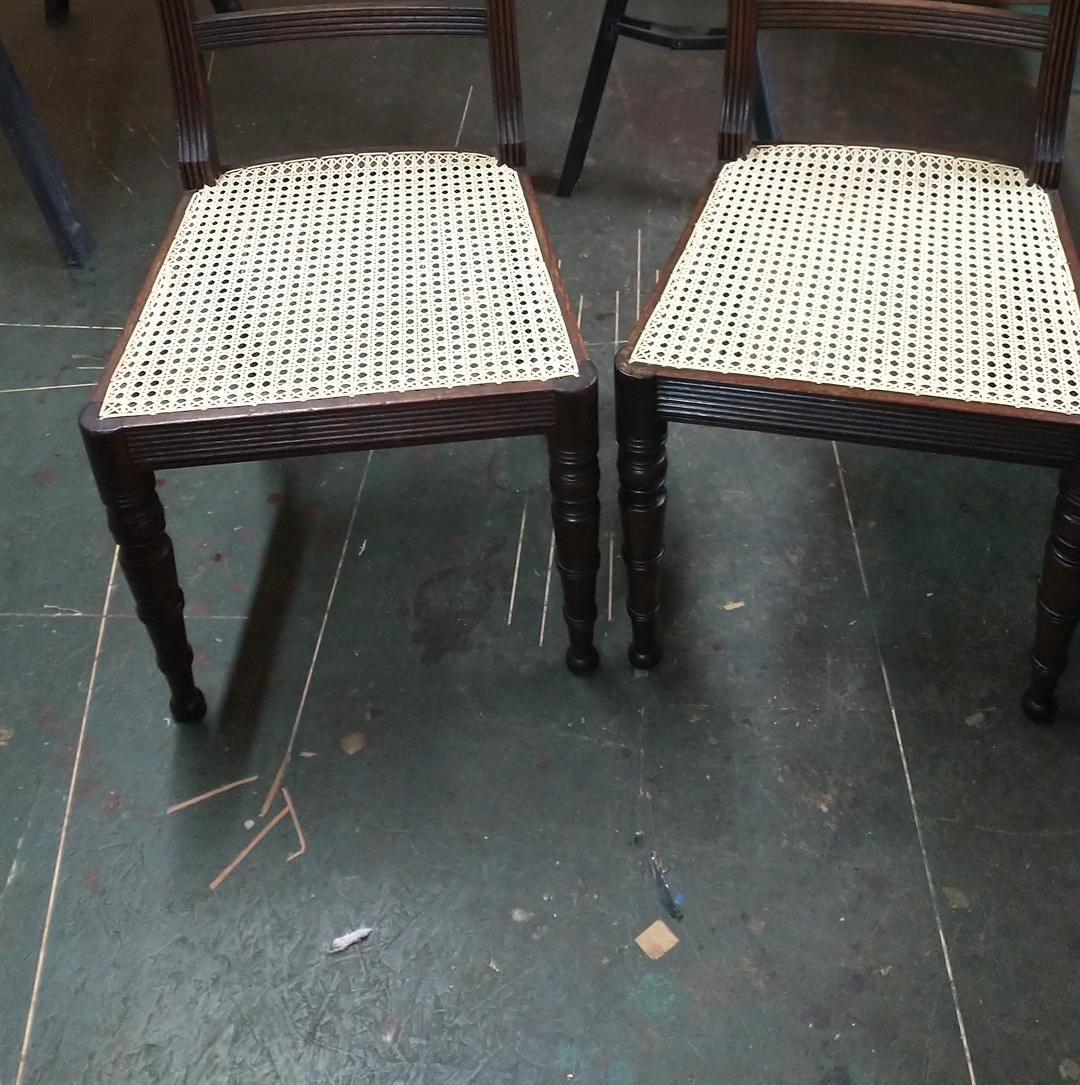 The same pair of Regency chairs with new hand-woven cane seats